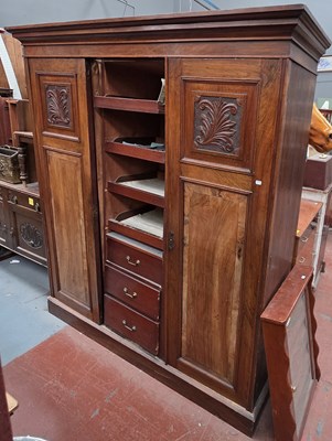 Lot 34 - An Edwardian walnut triple compactum wardrobe...