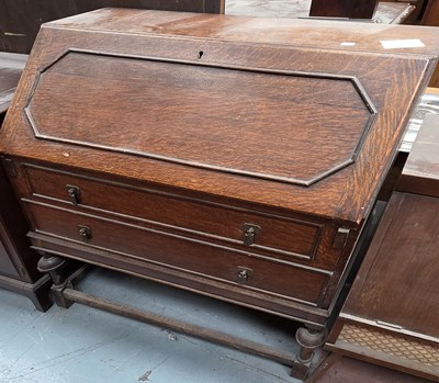 Lot 57 - An early 20th century oak bureau, the...