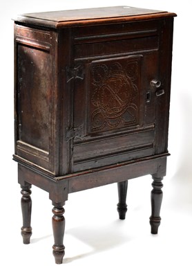 Lot 159 - A Georgian oak side cabinet, with later carved...