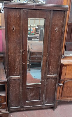 Lot 71 - An early 20th century oak hall robe, the...