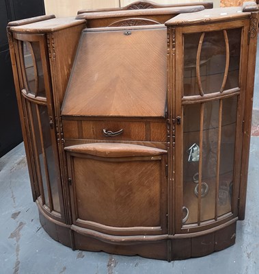 Lot 105 - A 1940s oak bureau display cabinet, with...