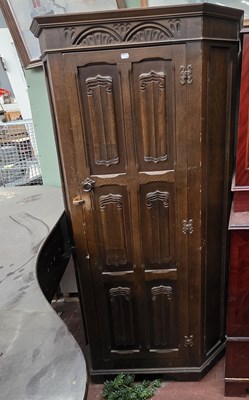 Lot 121 - An early 20th century oak hall robe, with...