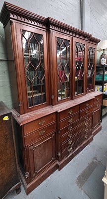 Lot 133 - A large reproduction mahogany breakfront...