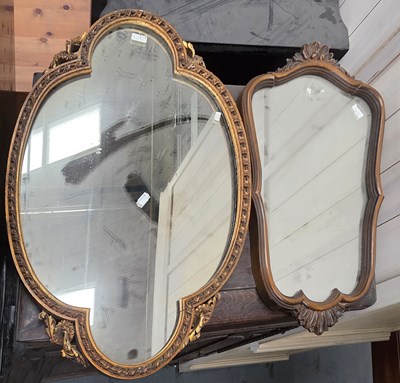 Lot 137 - A gilt framed wall mirror of shaped form, 76 x...