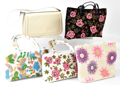 Lot 557 - Four beaded handbags and a cream leather...