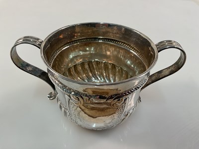 Lot 566 - A Queen Anne hallmarked silver twin handled...