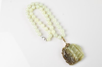 Lot 1026 - An early 20th century Chinese green hardstone...