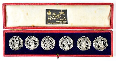 Lot 703 - A set of six pierced white metal lily of the...