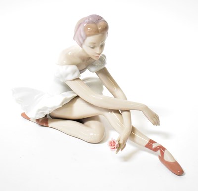 Lot 221 - LLADRÓ; a figure of a seated ballerina,...