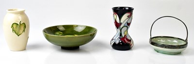 Lot 258 - MOORCROFT; four pieces of Moorcroft comprising...