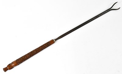 Lot 545 - An Indian toasting fork, with carved wooden...