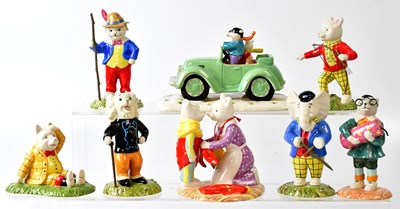 Lot 232 - ROYAL DOULTON; eight Rupert Bear figures...