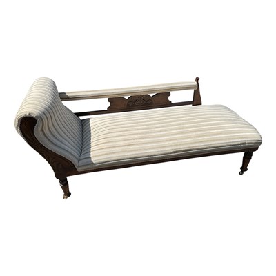 Lot 168 - An Edwardian carved walnut chaise lounge on...