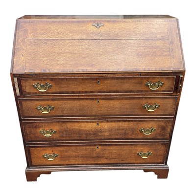 Lot 202 - An 18th century oak bureau.