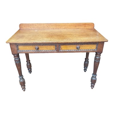 Lot 166 - A Victorian carved oak two-drawer side table...