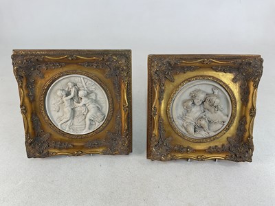 Lot 411 - Two Italian style relief moulded circular...