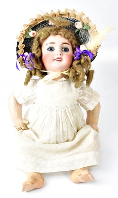 Lot 498 - A French bisque headed 'baby' doll with blue...