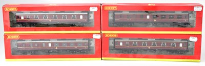 Lot 335 - HORNBY; four boxed model railways coaches,...