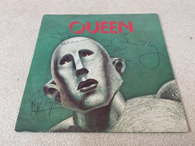 Lot 41 - QUEEN; a 45rpm 'We will Rock You', bearing the...