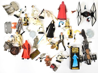 Lot 451 - STAR WARS; a collection of figures, including...