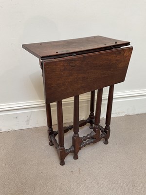 Lot 43 - An early 17th century Jacobean oak drop-leaf...