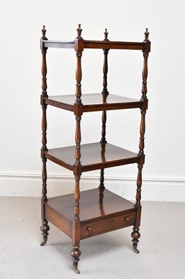 Lot 62 - A Victorian rosewood four tier whatnot with...