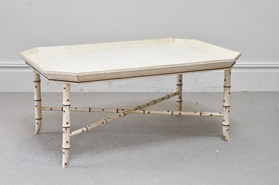 Lot 71 - A cream painted tray top coffee table, on...
