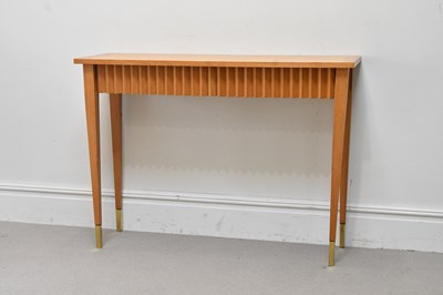Lot 66 - A contemporary light oak rectangular console...