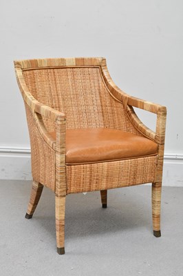 Lot 72 - A contemporary rattan open sided elbow chair...