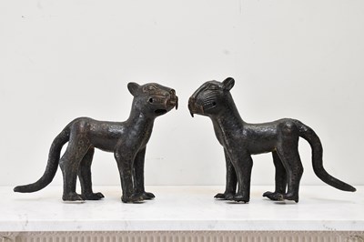 Lot 119 - BENIN; a pair of bronze stylised leopards,...