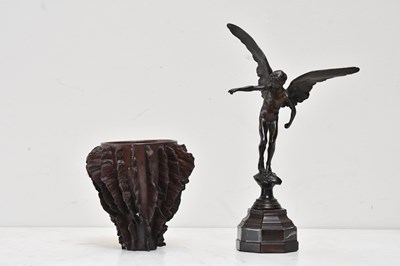 Lot 125 - A bronze model of a winged cherub after...