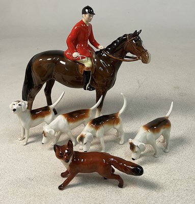 Lot 328 - BESWICK; a huntsman figure in Pink coat on a...