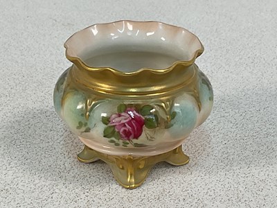 Lot 305 - ROYAL WORCESTER; a handpainted vase on four...