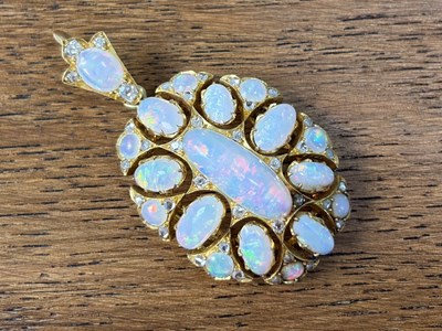 Lot 635 - A late 19th/early 20th yellow metal opal and...