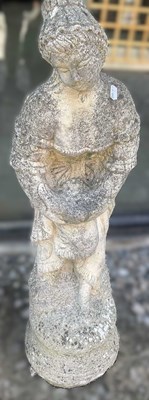 Lot 898 - A reconstituted concrete girl with bird,...