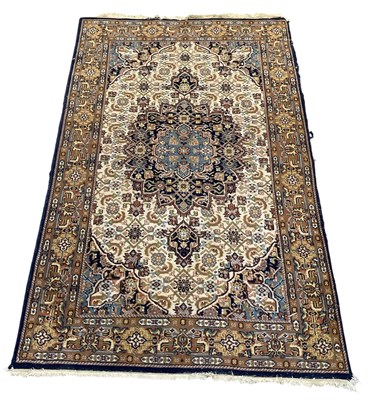 Lot 128 - A modern Indian hand woven woollen cream and...