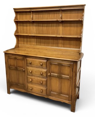 Lot 51 - ERCOL; a modern medium elm dresser, with...