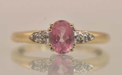 Lot 1240 - A yellow gold dress ring, with a claw set oval...