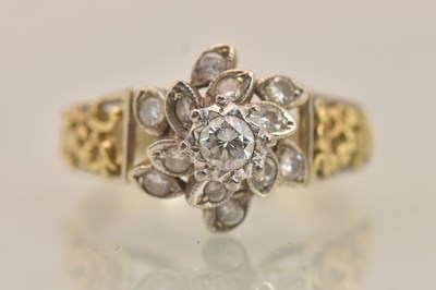 Lot 1207 - An 18ct yellow gold diamond cluster ring, the...