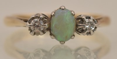 Lot 1235 - An 18ct yellow gold and platinum tipped opal...