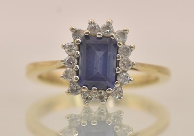 Lot 1272 - A 9ct yellow gold dress ring, with sapphire...
