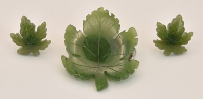 Lot 1194 - A cut green jade leaf brooch, length 3.3cm,...