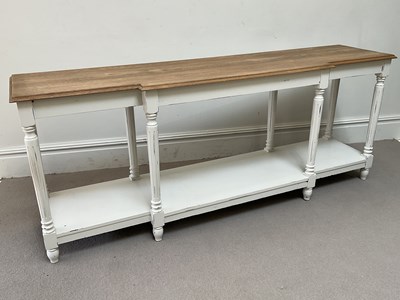 Lot 29 - OKA; a modern hall table with black painted...