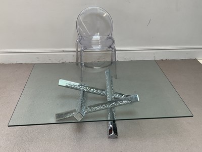 Lot 30 - ROCHE BOBOIS: a glass top coffee table on...