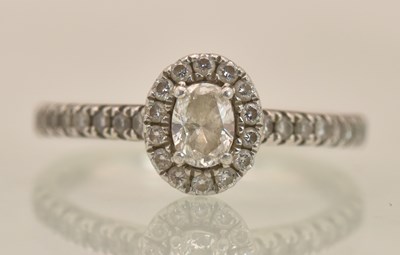 Lot 1209 - A platinum (PT950) diamond cluster ring, the...