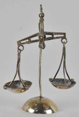 Lot 1172 - A pair of miniature Arabic white metal scratch-...