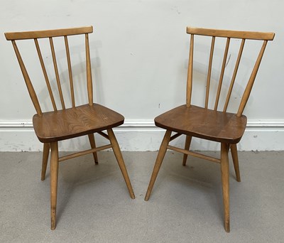 Lot 13 - ERCOL; a pair of elm Model 391 chairs (2).