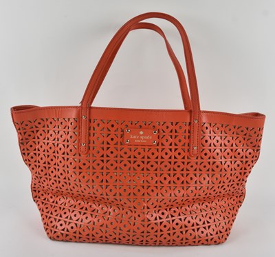 Lot 462 - KATE SPADE; an orange geometric cut-out mesh...