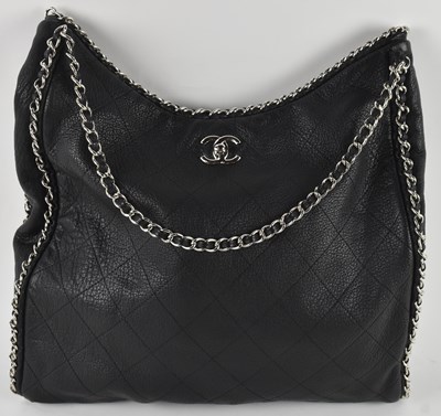Lot 450 - CHANEL; a vintage black leather lady's hobo...