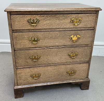 Lot 141 - Georgain oak chest for four draws on bracket feet